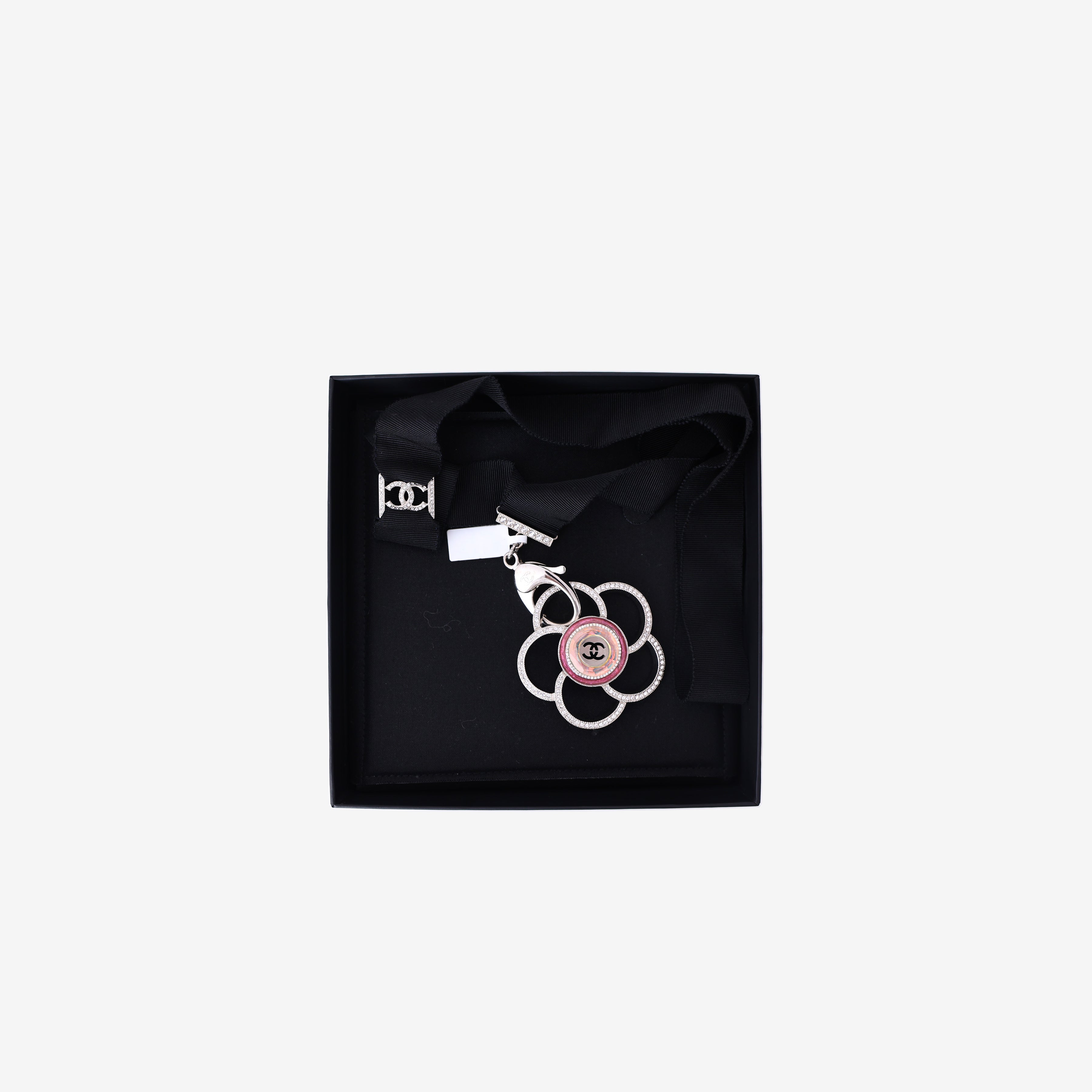 Chanel Camellia Pendant Necklace in Black Grosgrain Ribbon with Crystal Detailing and Silver Hardware front view