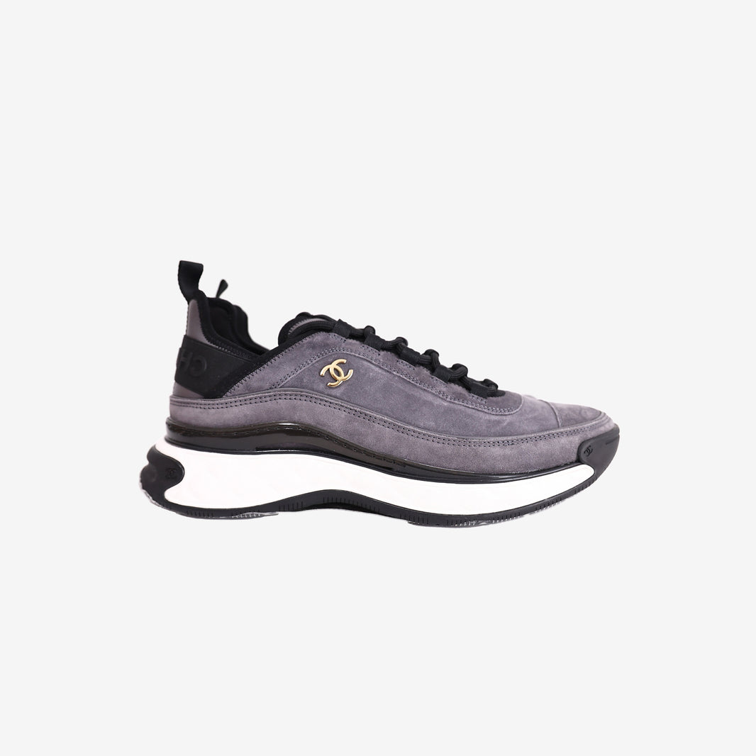 Chanel 23K CC Logo Sneakers in Grey and Black Suede with Gold Logo Detail (Size 41.5)