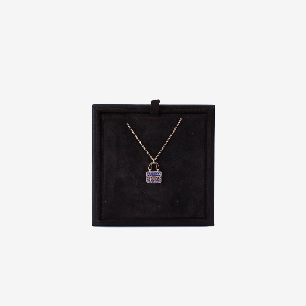 Hermès Amulettes Constance Pendant in Rose Gold with Blue Sapphires front view