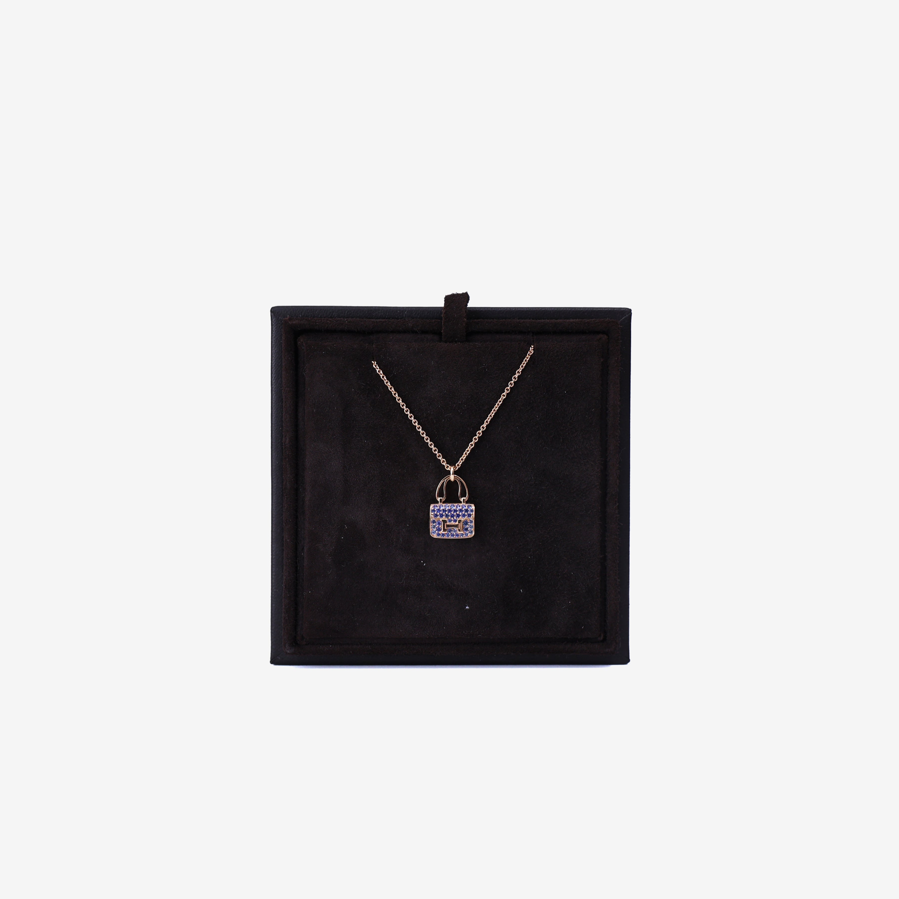 Hermès Amulettes Constance Pendant in Rose Gold with Blue Sapphires front view