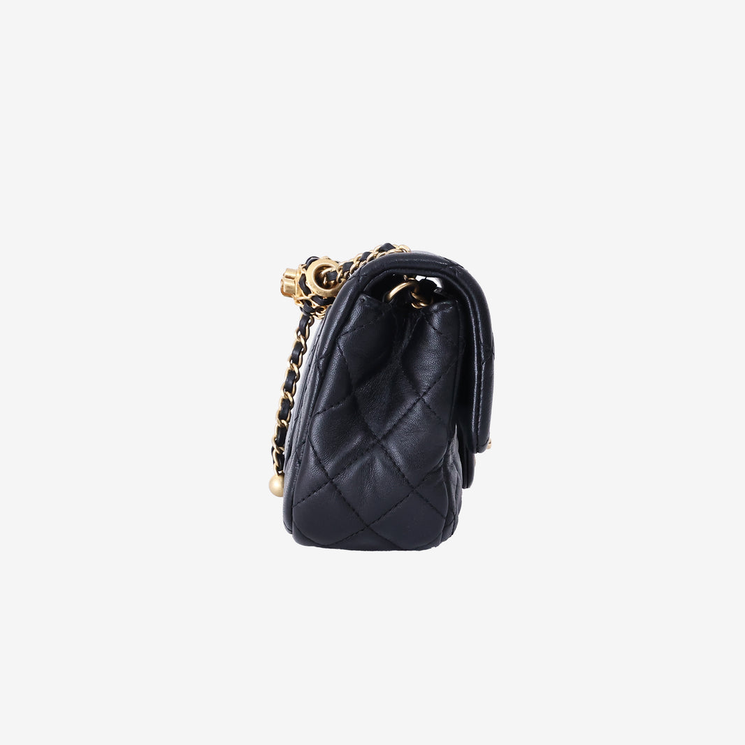 Chanel Mini Classic Flap Bag in Black Lambskin Leather with Gold Hardware