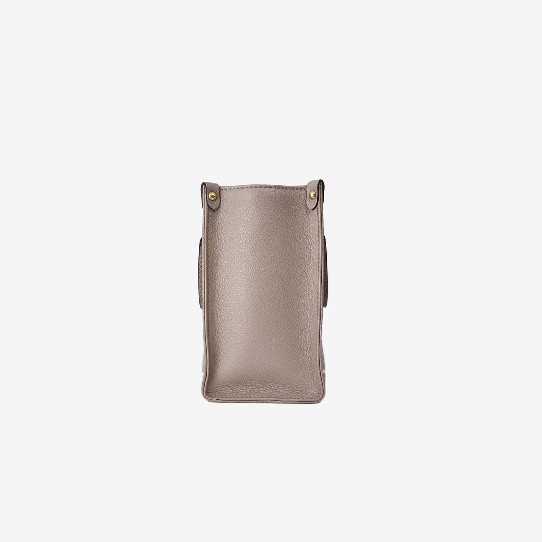 Louis Vuitton OnTheGo PM Tote Bag in Tourterelle/Crème Monogram Empreinte Leather with Gold Hardware