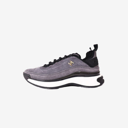 Chanel 23K CC Logo Sneakers in Grey and Black Suede with Gold Logo Detail (Size 41.5)