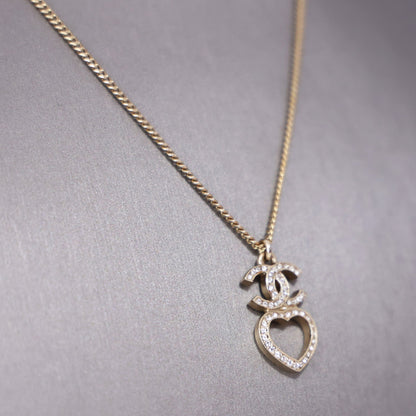 Chanel CC Heart Dangle Necklace in Gold Metal with Crystal and Imitation Pearls detail view