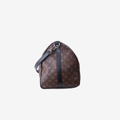 Louis Vuitton Keepall Bandoulière 55 in Monogram Macassar Coated Canvas with Black Leather and Silver Hardware