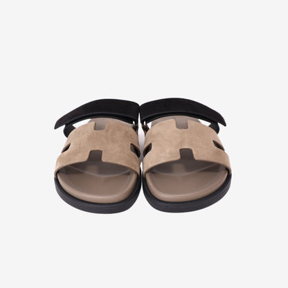 Hermès Chypre Techno-Sandals in Étoupe and Noir Suede Goatskin front view