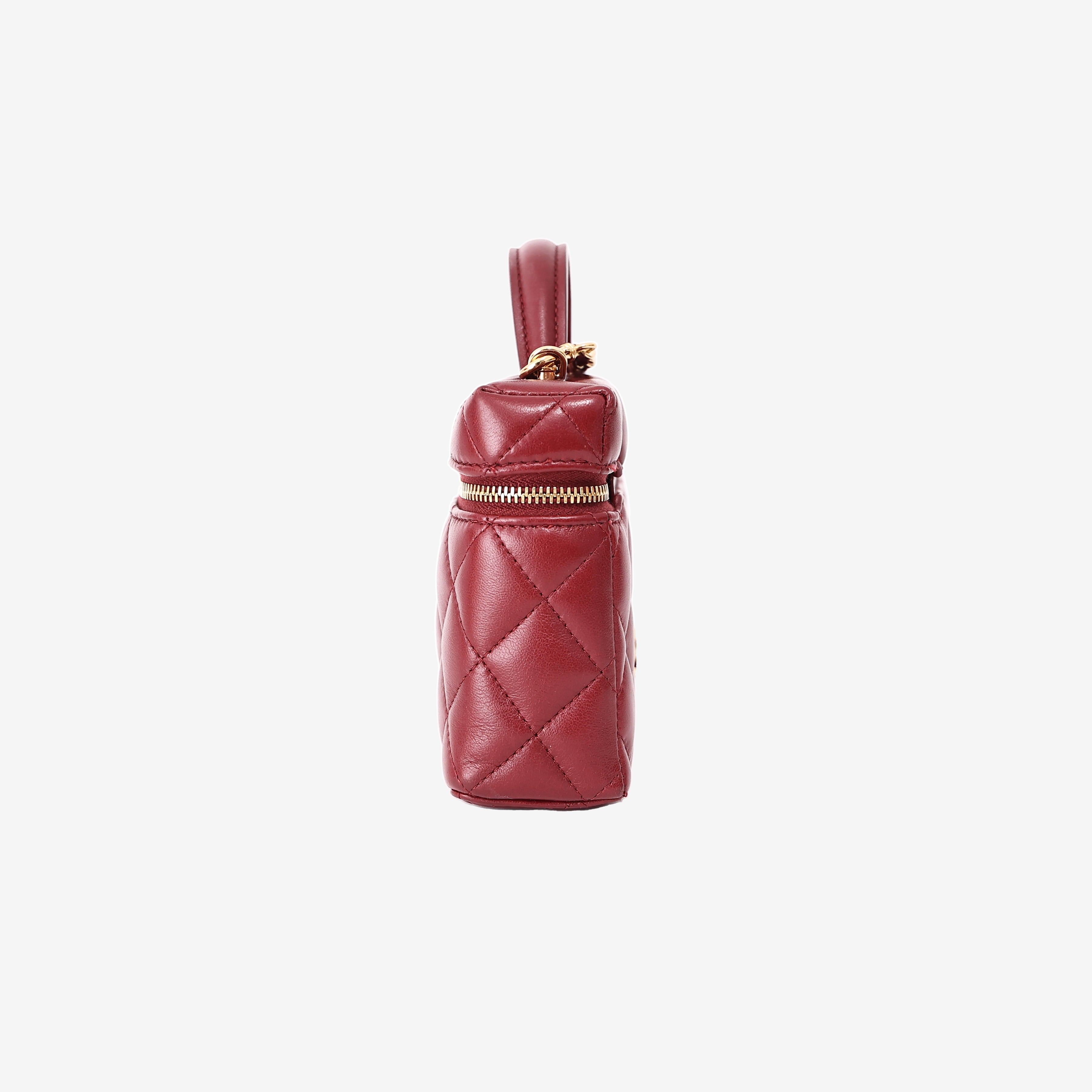 Chanel Vanity Bag with Top Handle in Burgundy Lambskin Leather with Gold Hardware side view