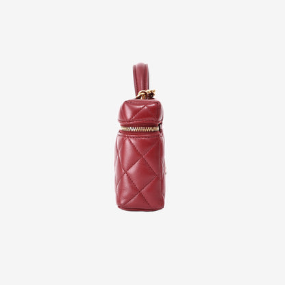 Chanel Vanity Bag with Top Handle in Burgundy Lambskin Leather with Gold Hardware side view