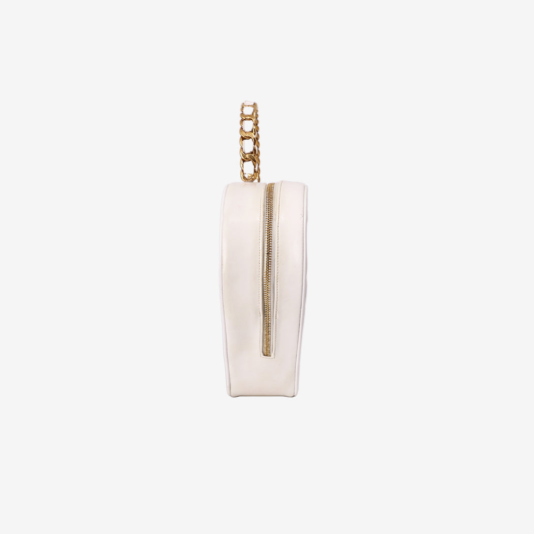 Chanel Vintage Heart-Shaped Vanity Bag in White Patent Leather with Gold Hardware side view
