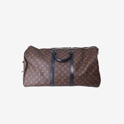 Louis Vuitton Keepall Bandoulière 55 in Monogram Macassar Coated Canvas with Black Leather and Silver Hardware