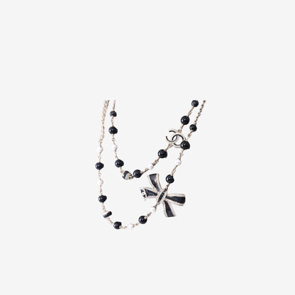 Chanel Long Sautoir Necklace in Black & White Beads with Crystal Bow, Faux Pearls & Gold-Tone Hardware