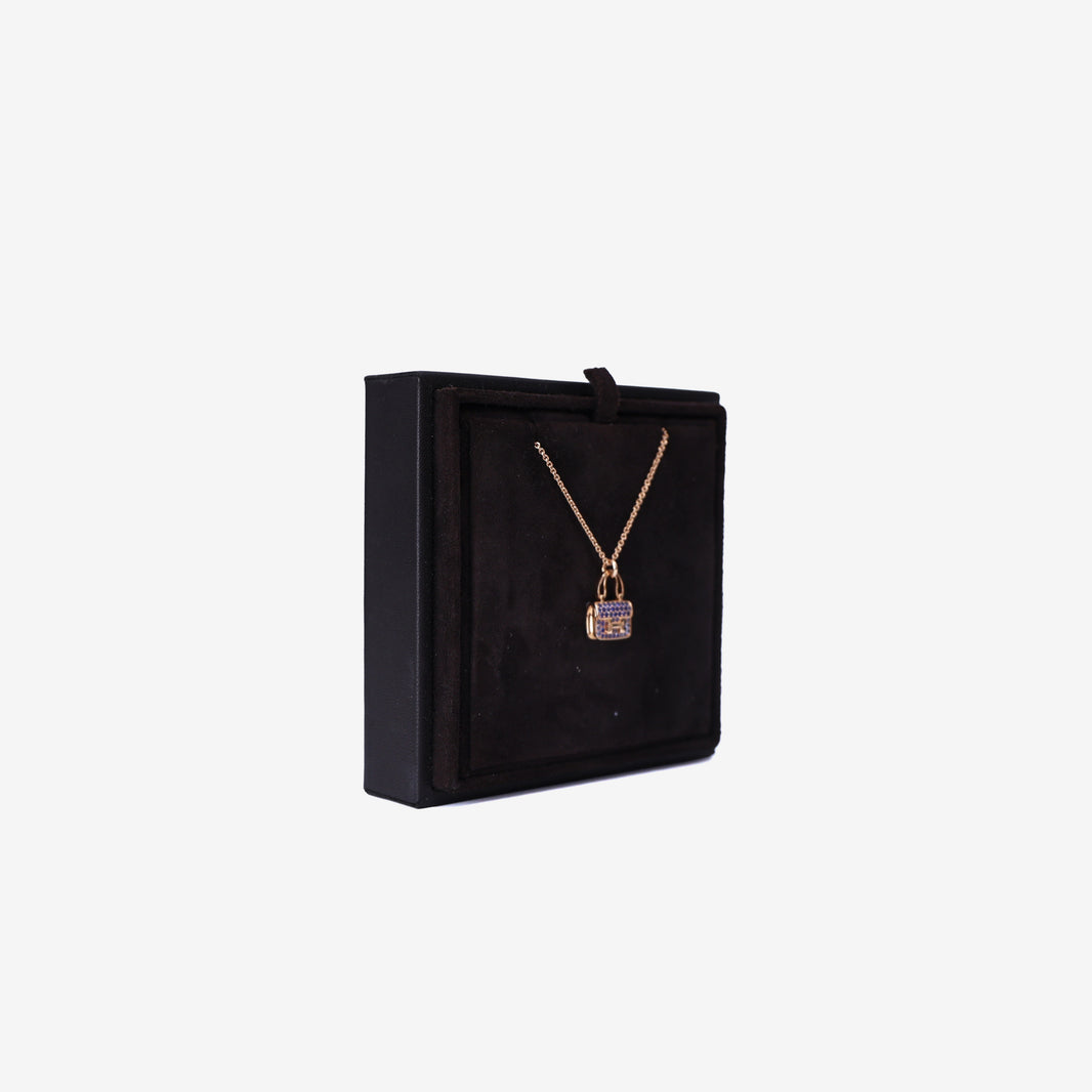Hermès Amulettes Constance Pendant in Rose Gold with Blue Sapphires side view