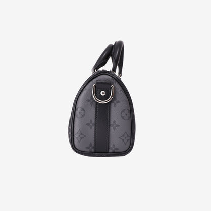 Louis Vuitton Keepall 25 in Monogram Eclipse Reverse Canvas with Black Leather Trim side view