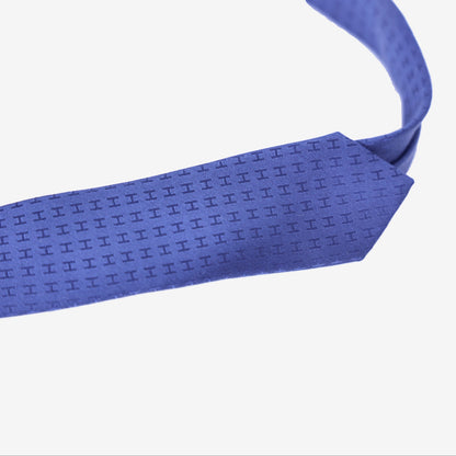 Hermès Façonnée H Tie in Indigo Silk detail view