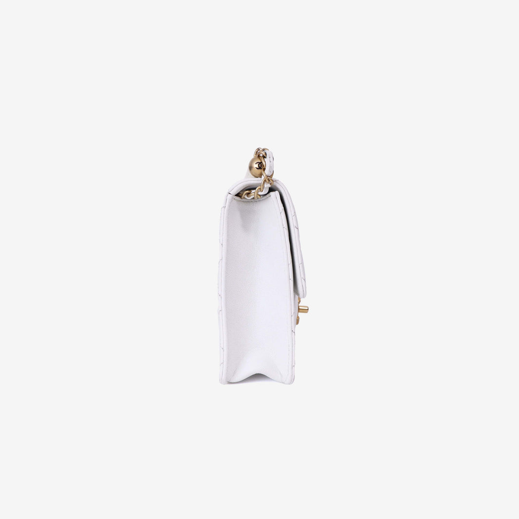 Chanel Classic Flap on Pearl Chain in White Lambskin with Gold Hardware side view