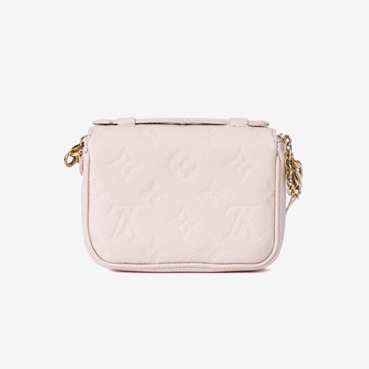 Louis Vuitton Micro Métis in Beige Calfskin Leather with Gold Hardware back view