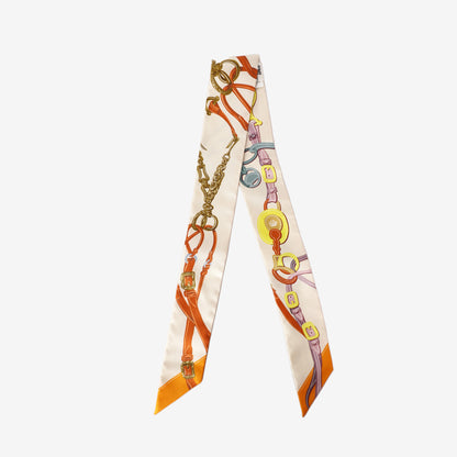 Title: Hermès Brides de Gala Appliqué Piqué Twilly in Crème/Orange/Jaune Silk back view