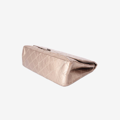 Chanel 2.55 Reissue Maxi Double Flap Bag in Metallic Champagne Lambskin Leather with Ruthenium Hardware