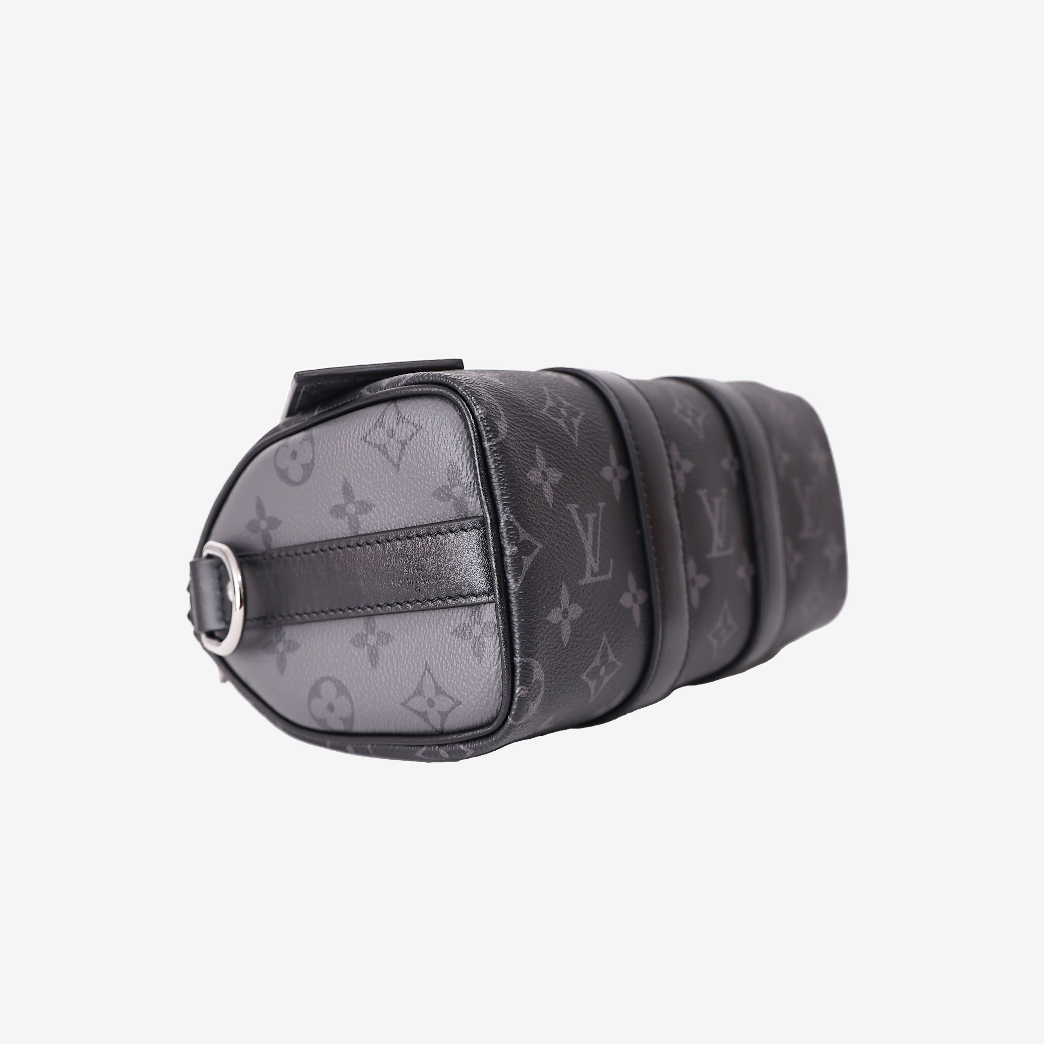Louis Vuitton Keepall 25 in Monogram Eclipse Reverse Canvas with Black Leather Trim bottom side view