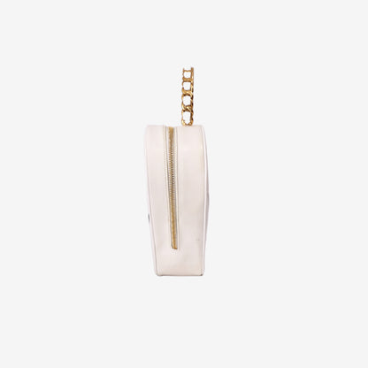 Chanel Vintage Heart-Shaped Vanity Bag in White Patent Leather with Gold Hardware side view