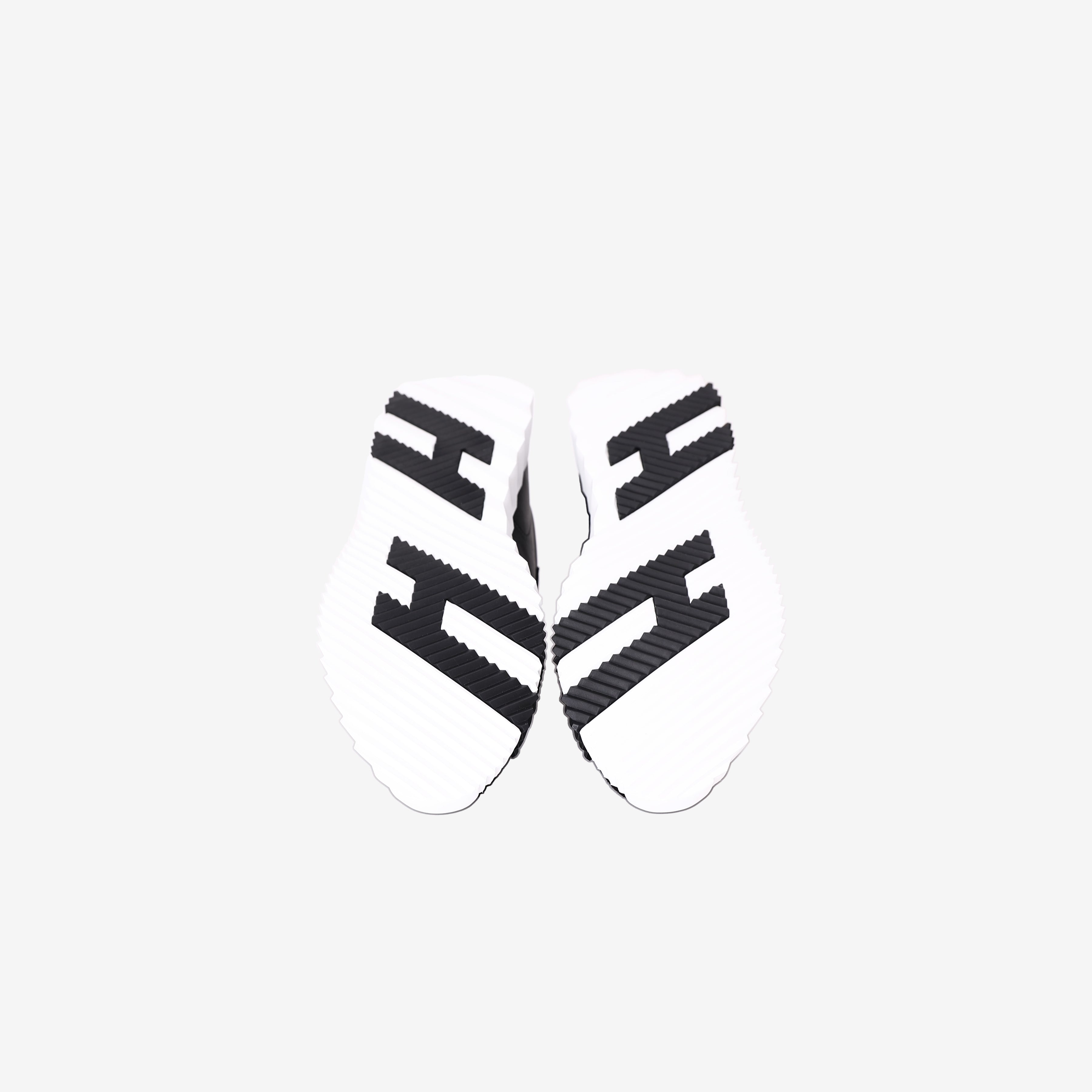 Hermès Bouncing Sneakers in Noir Calfskin and Suede Goatskin bottom view