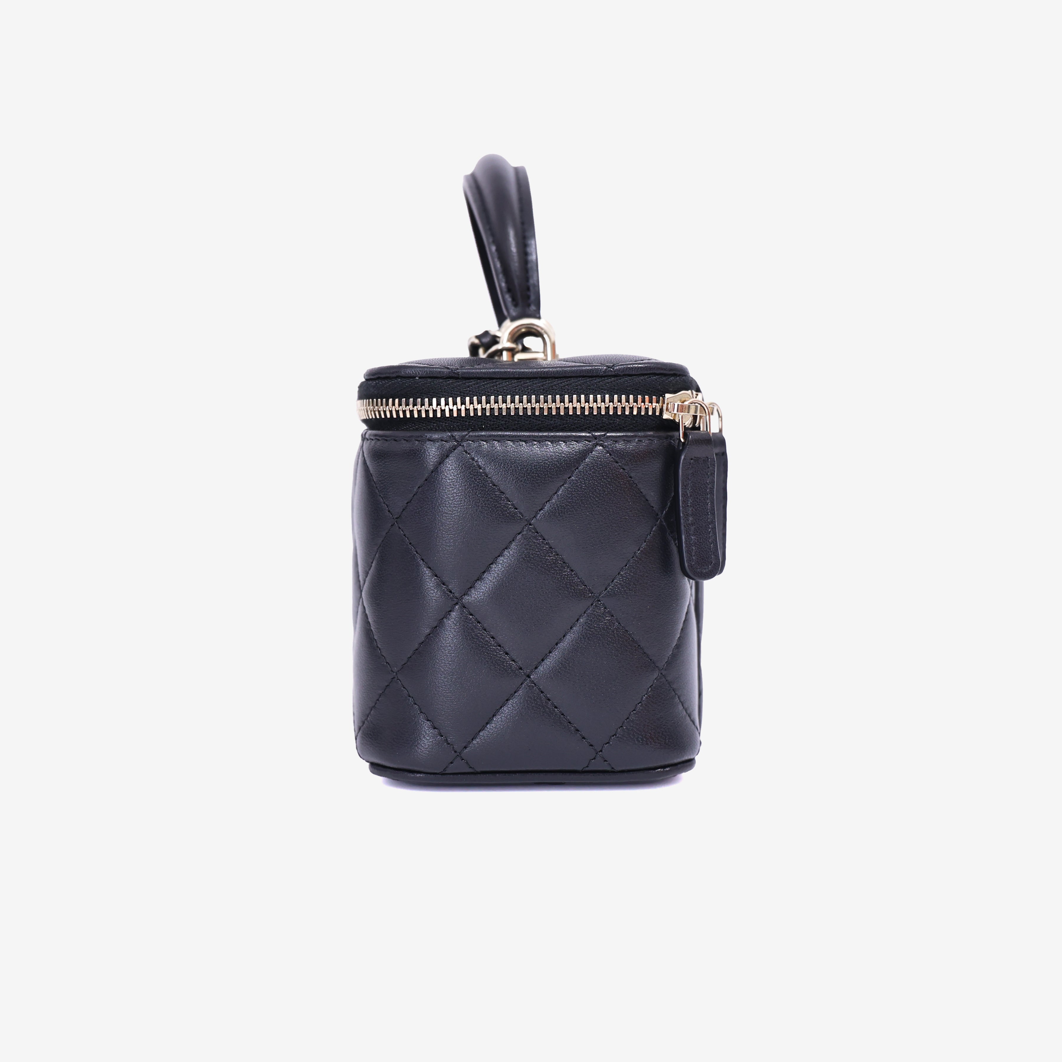 Chanel Vanity Case with Top Handle in Black Lambskin Leather with Gold Hardware side view
