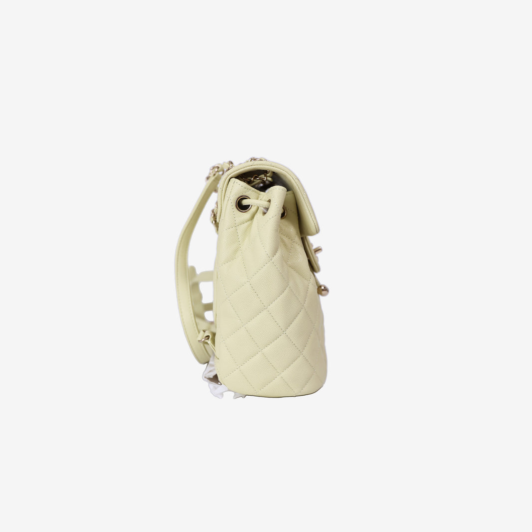 Chanel Urban Spirit Mini Backpack in Light Yellow Caviar Leather with Silver Hardware side view