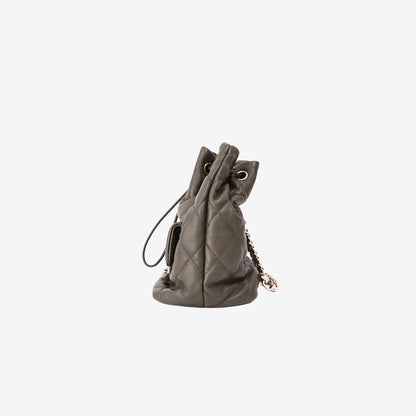 Chanel Duma Drawstring Backpack in Khaki Lambskin Leather side view