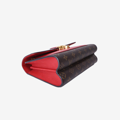 Louis Vuitton Victoire Bag in Monogram Coated Canvas/Red Leather with Gold Hardware