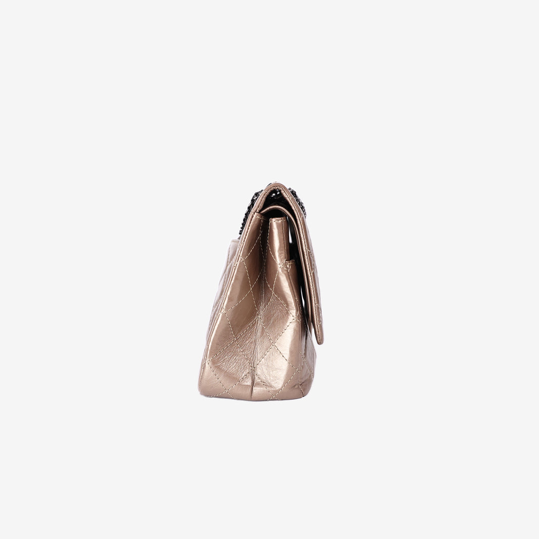 Chanel 2.55 Reissue Maxi Double Flap Bag in Metallic Champagne Lambskin Leather with Ruthenium Hardware