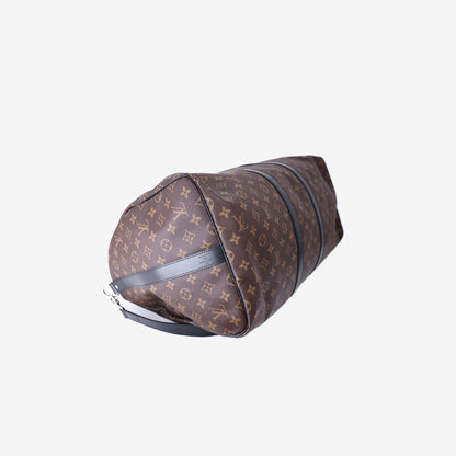 Louis Vuitton Keepall Bandoulière 55 in Monogram Macassar Coated Canvas with Black Leather and Silver Hardware