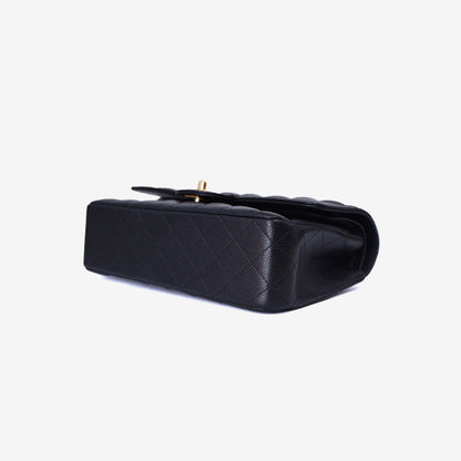 Chanel Classic Flap Bag Medium in Black Caviar Leather with Gold Hardware bottom side view
