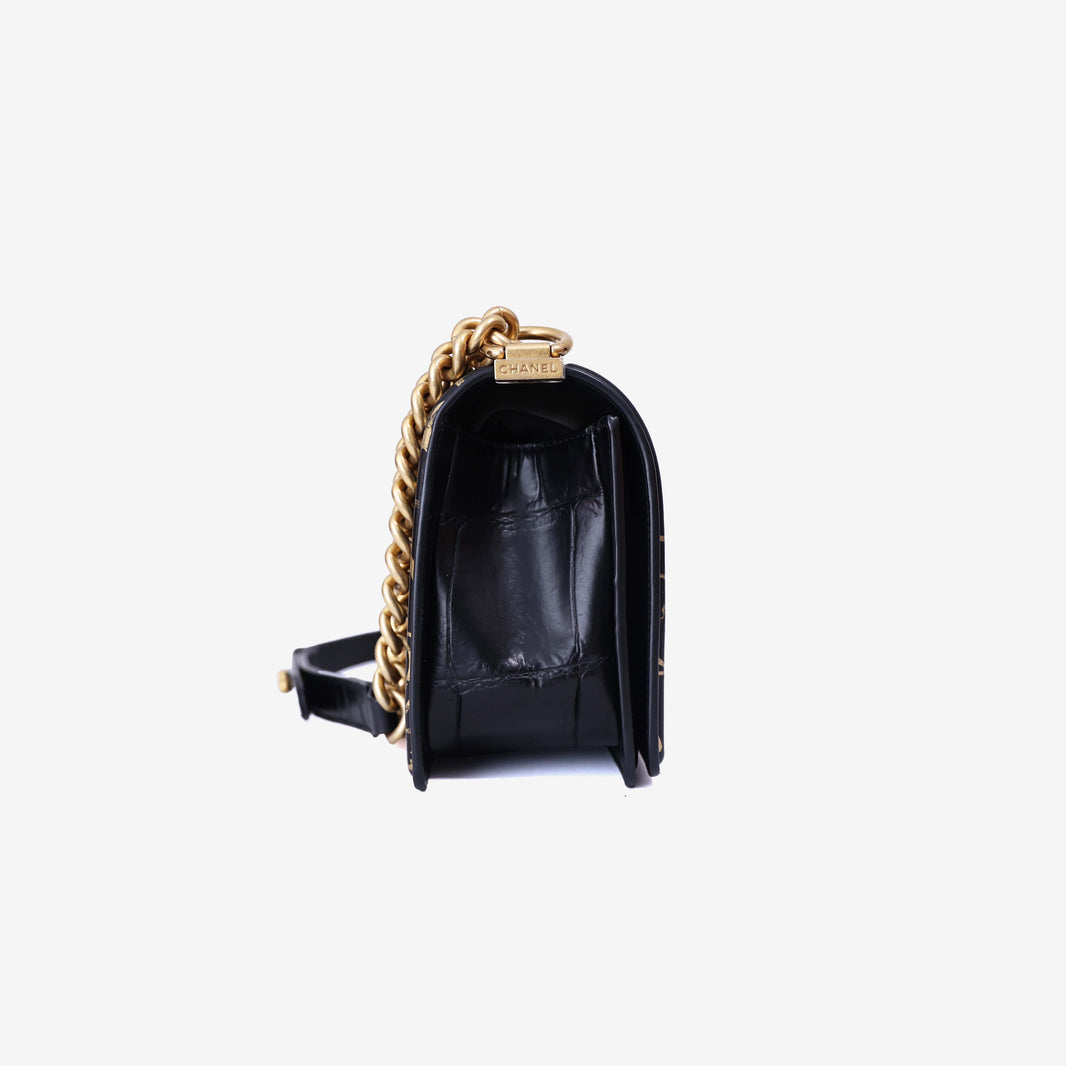 Chanel Medium Boy Flap Bag in Black Embossed Calfskin Leather with Gold Hardware side view