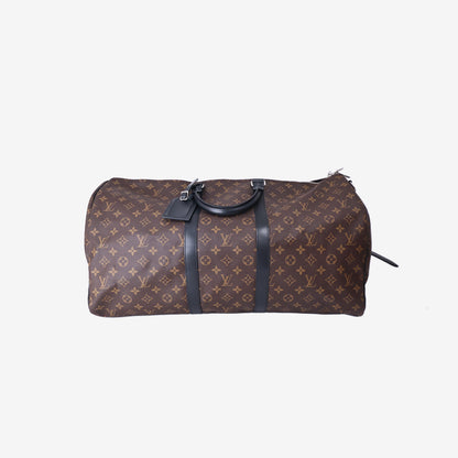 Louis Vuitton Keepall Bandoulière 55 in Monogram Macassar Coated Canvas with Black Leather and Silver Hardware