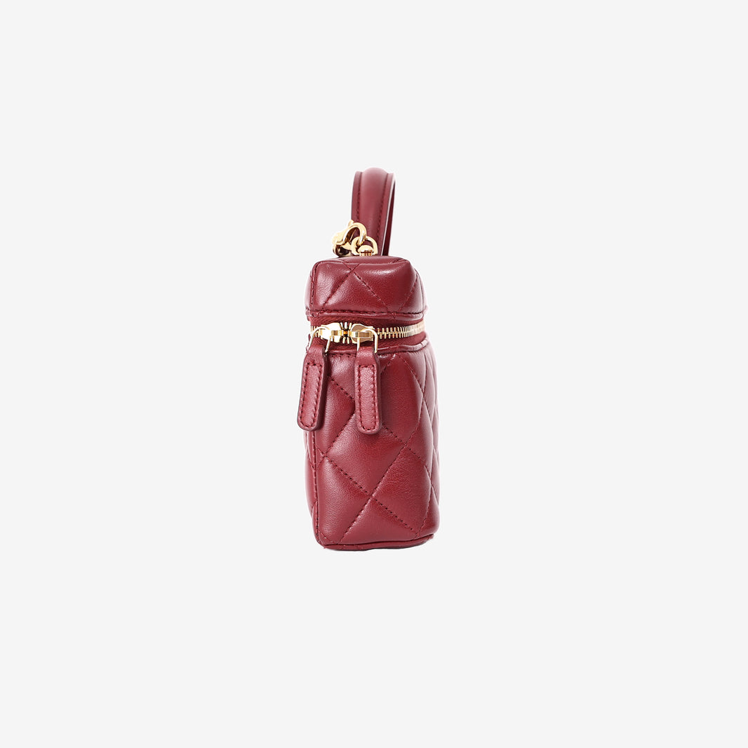 Chanel Vanity Bag with Top Handle in Burgundy Lambskin Leather with Gold Hardware side view