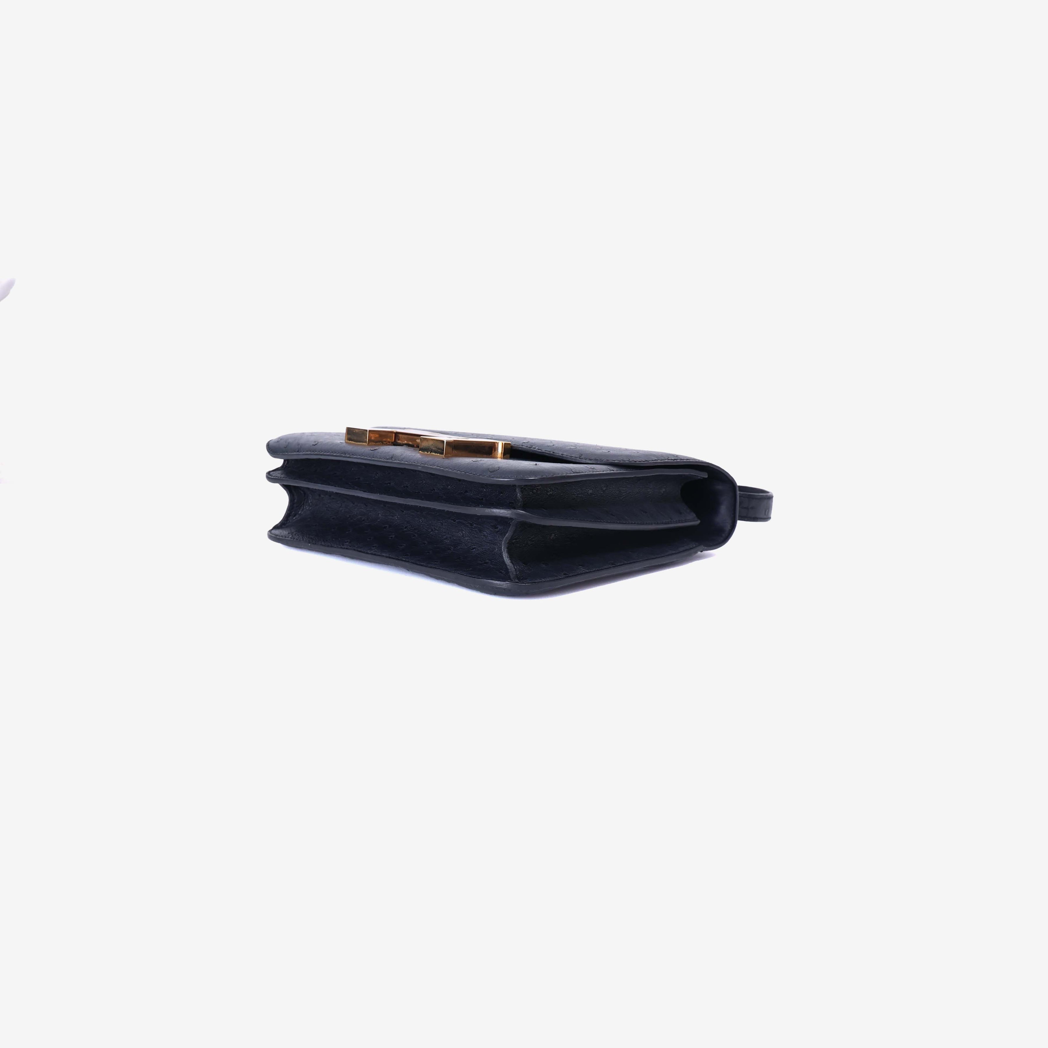 Hermès Constance 24 in Noir Ostrich Leather with Gold Hardware bottom side view