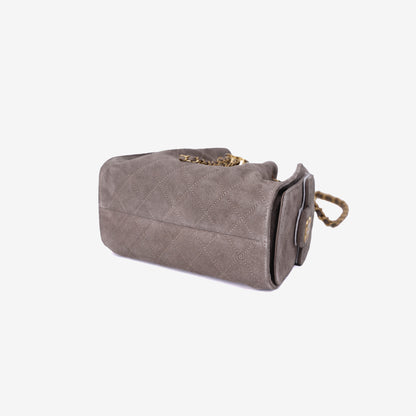 Chanel 25 Small Handbag in Dark Grey Suede with Gold Hardware bottom side view